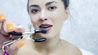 Clothespins on the nipples. big breasts