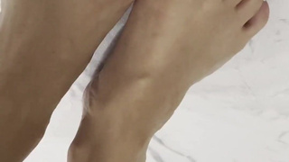 The student shakes her elastic ass, squatting right in front of the camera