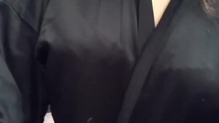 Sexy student in a bathrobe squeezes her breasts????????