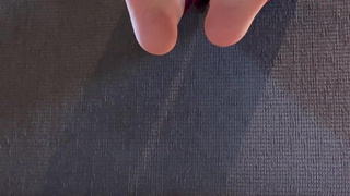 Plaid leggings, red nails size 12 feet hanging over couch