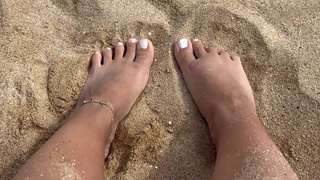 Happy feet playing in the sand