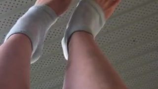 Stretching my cute feet with white painted toenails