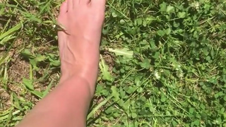 Lucy Love Walks Barefoot Outside in the Grass with Toe Play