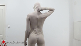 Putting on a leotard over a padlocked zentai