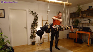 Girl in leather catsuit gets Shibari energy tied, suspended, nipple clamps. Real uncut play!
