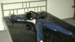 Latex Girl Sub Bondage In The Rubber Bed With Heavy Latex Gas Mask
