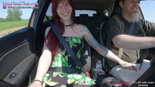 Girl putting on remote controlled vibrator and stimulated on drive to public park
