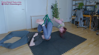 She's in a Facedown Shibari suspension, pussy spanking and breath play