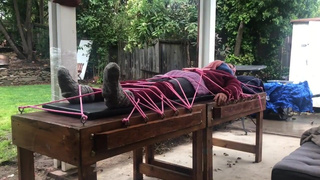 Wool mohair layers of sweaters on a bondage table