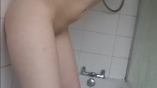 Teen fucks dildo in the shower