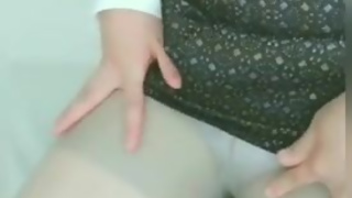 An amateur Japanese teacher breaks pantyhose and masturbates with a dildo full of saliva.