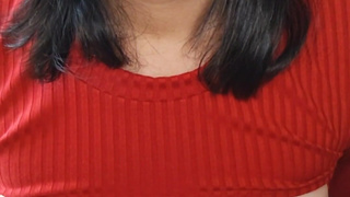 A Japanese woman who masturbates her nipples with a knitted dress and a ball gag