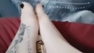 Giantess crushes tiny man between her tattooed feet