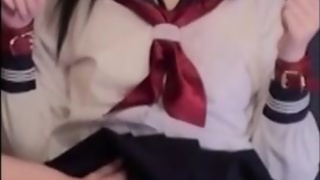 Japanese schoolgirl in sailor suits is restrained and made to moan with toys