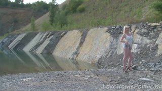 Hot blonde with big tits enjoys the lake