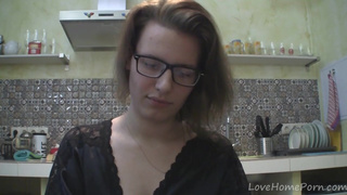 Solo girl with glasses chatting in the kitchen