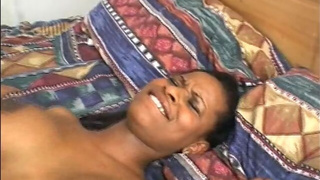 Ebony nurse gets her hairy pussy rammed by a black dude on the bed