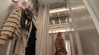 Voyeur. In a public shopping center, a girl inserts an anal plug into a beautiful ass. Fetish.