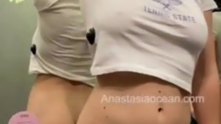 girls play together, touch each other in fitting room