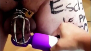 Teasing my slave in chastity with vibration to ruin his orgasm