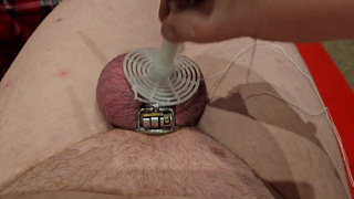 Fly Swatter Ballbusting in Chastity