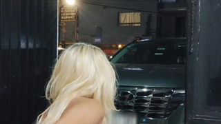 Sissy in chastity trying to drink a full bottle of beer via anal in the open door