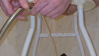 Shower hose enema and piss in chastity cage