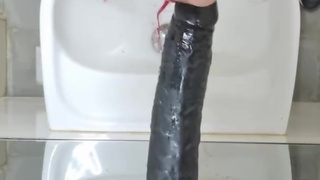 Sissy Adele deepthroat training in chastity