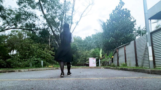 Sissy in chastity catwalk outdoors