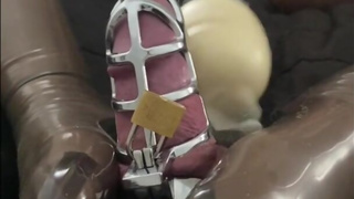 Teasing Latex Chastity Sub in Latex Stockings