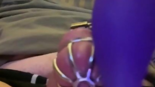 Caged sissy cumming with a vibrator