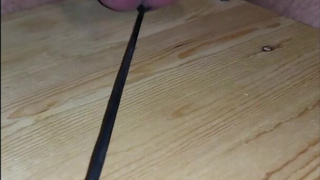 Hard self ballbusting with a crop and whip