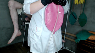 Chubby beautiful nurse gives a 1.5 liter enema bag to the patient