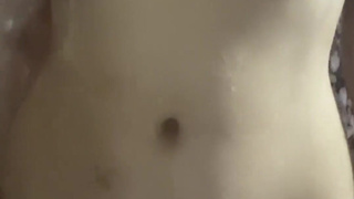 In the shower I masturbate in front of the camera and cum under the running water