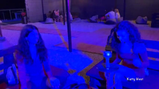 Two sluts dance at a public party and show boobs and butts