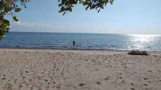 what the hell is he doing? caught a hottie on a public beach
