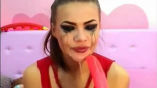Cam Girl Deep Throats Dildo in Bondage