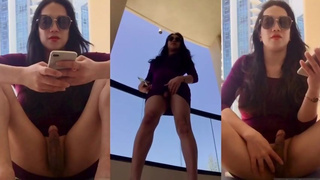 asian shemale ramp in hotel balcony showing her cock