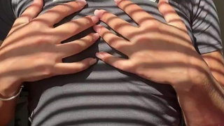 Hot wife teasing her boobs in the shadows