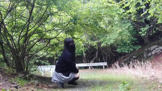 Transgender exposed and urinated outdoors on an abandoned road