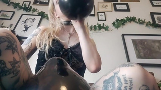 Blowing sexy goth balloons