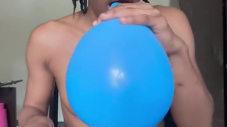 Blowing up balloons while naked