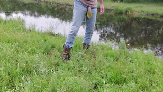 Pissing in condom in country (pee balloon)