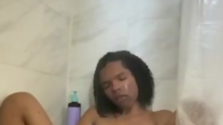 sydney in a hot shower playing with her dick