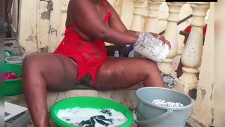 African babe doing laundry in a crotchless red lingerie