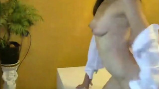 Alluring brunette babe strips on webcam